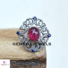 Pave Diamond Designer Ring, Ruby Gemstone Silver Ring, Diamond Gemstone Ring, 925 Silver Jewelry, Silver Sapphire Ring, Wedding Jewelry Gift Gross Weight: 7.73 gram Diamond Weight: 0.95 Cts Gemstone Weight: 7.25 Cts Ring Size: 29X28 MM NOTE:- All The Products Are Designed And Manufactured In My Workshop By Me & My Team. Shown Products Are Purely Handmade. Custom Orders Are Open Handly Accepted. We Are the Perfect Choice For Any Custom Jewelry Manufacturing. For Bulk Orders Please Message me. Fine Jewelry Diamond Rings With Stones, Elegant Ruby Ring With Diamond Settings, Exquisite Silver Round Ruby Ring, Silver Rings With Stones In Fine Jewelry Style, Cubic Zirconia Rings With Stones In Fine Jewelry Style, Fine Jewelry Sapphire Rings With Stones, Exquisite Silver Ruby Ring, Exquisite Sterling Silver Diamond Ring With Gemstone, Silver Rings With Stones Fine Jewelry