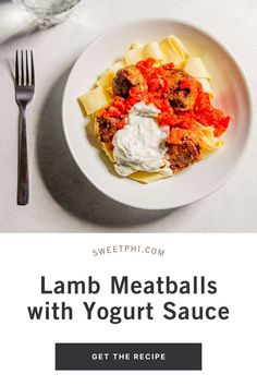 lamb meatballs with yogurt sauce on a white plate next to a fork