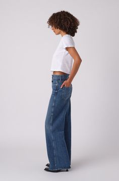 Make a statement in our best-selling high-rise, wide leg silhouette. With an easy fit though the hip and thigh and full inseam, they're your new everyday denim. Zip fly. COLOR: ADMIRE FIT & MEASUREMENTS: Inseam = 33" Front Rise = 12 1/2" Back Rise = 16 1/2" Leg Opening = 23" Measurements taken from size 27 Taliha is wearing size 25 and is 5"10" Easy, relaxed fit Take your normal size for a full easy fit, or size down to be more fitted around the waist Fabric & Care: 100% Organic Cotton Machine w Parachute Pant, Upcycled Bag, Pleated Shorts, Boy Tees, Sleeveless Shirt, Cami Dress, Crop Shirt, Vintage Sweatshirt, V Neck Tee