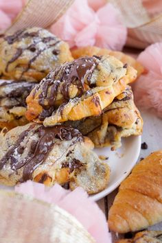 chocolate covered croissant cookies on a plate