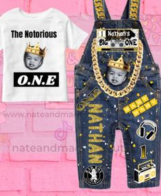 a pair of overalls and t - shirt with an image of a baby wearing a crown