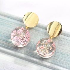 Very Cute And Dainty Earrings Featuring Clear Resin Spheres (Flat Backs) With The Tiniest Pink Flowers . They Look Quite Magical! Goldtone. Zinc Alloy. Nwt. Boutique Elegant Pink Flower Earrings, Trendy Round Flower Earrings For Gift, Trendy Round Flower Earrings As Gift, Pink Earrings For Mother's Day Party, Pink Party Earrings For Mother's Day, Mother's Day Pink Drop Earrings, Pink Round Earrings For Jewelry Making, Round Pink Earrings For Jewelry Making, Pink Flower Earrings For Mother's Day