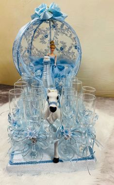 a glass figurine with a horse in the center surrounded by wine glasses and an umbrella