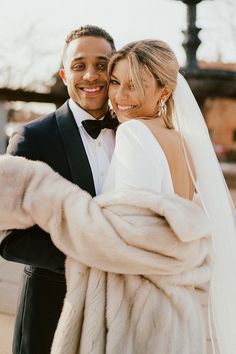 a bride and groom taking a selfie together