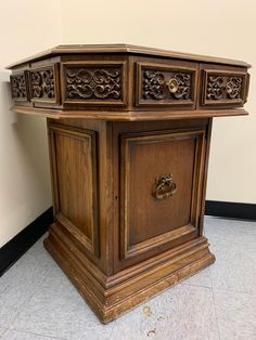 an old wooden cabinet sitting on the floor