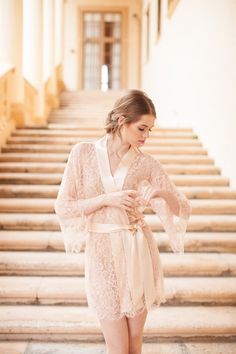 Treat yourself to luxurious French Chantilly lace and utterly soft silk in the softest shade of ivory. Featuring a lovely all over tulip floral motif, scalloped hem and sleeves with silk band lapel, flared kimono sleeves, and silk sash tie. The Fleur le Ressort incites aesthetic pleasure as a carefully composed floral landscape blankets your body, creating a picturesque scene that mirrors a Spring-bloom of perennials. Compliment your natural complexion underneath the unlined lace. The lace is so Bridal Kimono Robe, Vera Wang Wedding Gowns, Bridal Dressing Gown, Silk Bridal Robe, Bridal Robe Lace, Vera Wang Wedding, Bridal Kimono, Chic Vintage Brides, Traditional Japanese Kimono