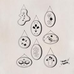 a drawing of several ornaments hanging on a wall