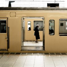 a woman walking out of a train door