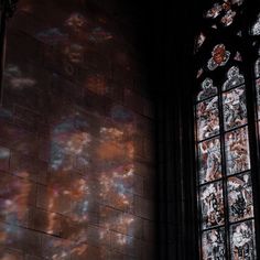 the sunlight is shining through stained glass windows