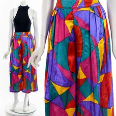 "- 70s/80s colorful satin pleated palazzo pants - rainbow pucci style print with accordion knife pleat - elastic waist - zipper and button back closure - single seam - some distressing Fits like:  S - M Material:  Polyester Condition:  Good (some small runs/stains) Clipped on Mannequin: Yes ✂ SIZE + FIT ✂ Length: 35\" / 89 cm Waist: 28\" to 34\" / 71 cm to 86 cm Hips: 56\" / 142 cm Inseam: 22\" / 56 cm Rise: 30\" / 76 cm All measurements are taken with garment lying flat. ALWAYS refer to measurements as vintage sizes can vary greatly from today's modern sizes. We recommend comparing measurements above with a similar style garment you own for best fit before purchasing.  DRESS FORM / MANNEQUIN is wearing the size detailed above but she typically measures a size 4/6 by modern retail sizes or Pleated Palazzo Pants, Dress Form Mannequin, Knife Pleat, Dress Form, Palazzo Pants, Capri Pants, Elastic Waist, Ready To Wear, Cashmere