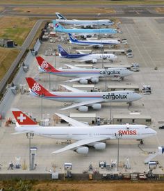 several airplanes are lined up on the tarmac at an air port run - way