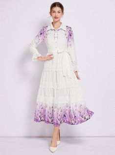 Captivating and ethereal, this enchanting long-sleeved dress is a portrait of bucolic elegance. Its fitted bodice descends into a gently tiered skirt, creating a silhouette that’s both classic and whimsical. The crisp white fabric serves as a canvas for delicate floral patterns that bloom across the hem, lending a touch of springtime regardless of the season. Lace trims add a sophisticated touch, framing the neckline and cuffs with exquisite detail. With a cinched waist accentuated by a self-tie belt, this dress shapes a figure that is both graceful and poised. It’s a versatile piece that transitions seamlessly from a countryside stroll to a chic urban evening. Fabric name: polyester fiberPattern: printingSkirt length: long skirtSkirt type: large swing typeSleeve length: long sleevesColor: Lapel Dress, Soft Lavender, Antique Fashion, Lace Trims, Sleeved Dress, Dress Shapes, Tiered Skirt, Types Of Skirts, Cinched Waist