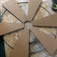 several pieces of cardboard sitting on top of a table