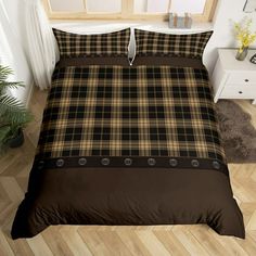 a bed room with a neatly made bed and brown comforter on top of it