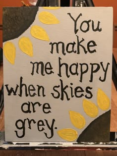 a sign that says you make me happy when skies are grey