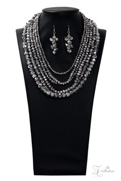 Dipped in half in a metallic shimmer, a scintillating collision of a faceted hematite and crystal-like beading drape across the chest for a spellbinding look. Held together by two silver fittings, the blinding strands gradually increase in size as they trickle down the chest fearless finish. Features an adjustable clasp closure. Sold as one individual necklace. Includes one pair of matching earrings 7/30/19 Paparazzi Accessories Jewelry, Paparazzi Consultant, Rachel Ray, Hematite Crystal, Friend Jewelry, Single Bead, Independent Consultant, Black Bead Necklace, Paparazzi Accessories