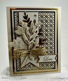 a close up of a card with leaves on it and a ribbon around the edge