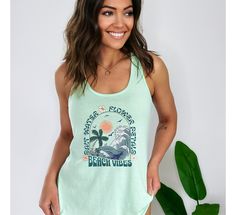 "Get in a tropical state of mind with this retro tank top featuring a design of waves, palm trees, and the text \"Salt Water, Flower Petals, Beach Vibes\" in a fun retro font. Made with high-quality materials, this tank is perfect for a day at the beach or a casual outing with friends! .: Material: 60% combed ring-spun cotton, 40% polyester .: Extra light fabric (3.9 oz/yd² (132 g/m .: Slim fit .: Tear-away label .: Runs smaller than usual Waves Tank Top, palm trees, Beach Tank Top, Retro Tank T Summer Tank Top For Leisure, Green Summer Tank Top With Letter Print, Green Letter Print Tank Top For Summer, Summer Sleeveless Top For Leisure, Sleeveless Summer Top For Leisure, Summer Leisure Tank Top, Summer Sleeveless Top, Beach Letter Print Tank Top, Beach Sleeveless Tank Top With Letter Print