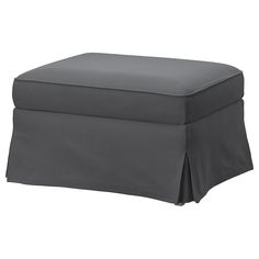 a gray ottoman with a cover on it