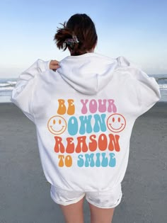 Be Your Own Reason To Smile  Hoodie ,Cute Hoodie, Aesthetic Hoodie ,Word's On Back Hoodie, Positivity Hoodie ,Tumblr Hoodie, Saying Hoodie A unisex heavy blend hooded sweatshirt is relaxation itself. The material is a thick blend of cotton and polyester. This makes for a plush, soft feel alongside warmth. It's also a great surface for printing. There are no side seams. A spacious kangaroo pocket hangs in front. The hood's drawstring is the same color as the base sweater.  .: 50% Cotton 50% Polye Fun Hoodie With Letter Print For Streetwear, Fun Letter Print Hoodie For Streetwear, Fun Hooded Hoodie With Letter Print, Fun Cotton Hoodie, Fun Cotton Hooded Hoodie, Funny Hooded Sweatshirt With Letter Print, Fun Hoodie With Letter Print, Fun Winter Hoodie With Letter Print, Winter Fun Hoodie With Letter Print