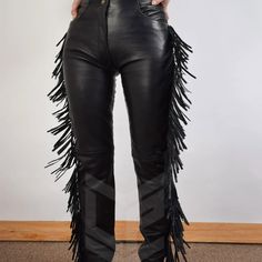 igh Waist Leather Fringe Pant, Western Pants, Leather Pants, Black Leather Pants, Women Fringe Pants, Festival Pants, Yoga Pants, Handmade The reassuring thickness and weight of these beauties just kind of makes you want to swagger and strut. Talk about fringe benefits Get your boogie on in these beautiful black fringe pants. Fringe Pants are made for movement, so feel free to wear them to dance ,High Waist, Pants, Yoga, Casual, Stretch, Comfort, Pant, Legging, Fringe, Boho, Hippie, Festival, Fl Leather Cowgirl Pants, Rocker Style Black Pants For Fall, Black Rocker Pants For Fall, Black Rocker Style Pants For Fall, Black High Waist Biker Bottoms, High Waist Black Biker Bottoms, Fitted Rocker Bottoms With Belt Loops, Black Fitted Pants For Biker Events, High Waist Fitted Biker Pants