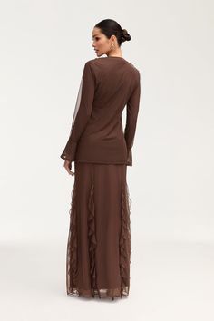 Indulge in the exquisite elegance of the Adriana Waterfall Mesh Maxi Skirt in Brown. Crafted from delicate mesh fabric, this skirt features a cascading waterfall ruffle detail and flattering princess seams. Perfect for making a sophisticated statement at any event or occasion. Model is 5'7" and is wearing size S/44". Please note this garment runs tight. We kindly recommend choosing one size up from your usual size. Elegant Skirt With Ruffles, Elegant Pleated Flowy Maxi Skirt, Elegant Skirt With Layered Hem For Spring, Elegant Spring Skirt With Layered Hem, Elegant Layered Hem Skirt For Spring, Elegant Layered Skirt For Spring, Elegant Flowy Maxi Skirt, Elegant Skirted Dress With Ruffles, Elegant Flowy Dress With Tulle Skirt