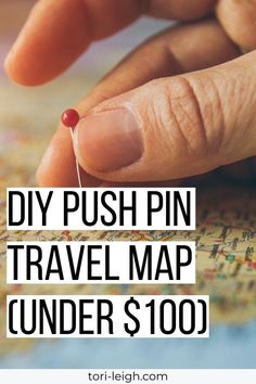 a person's hand pointing at a map with the words diy push pin travel map under $ 100