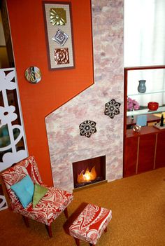 a living room filled with furniture and a fire place next to a wall mounted tv