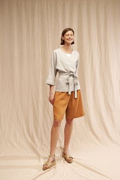 "Made in cool, comfortable linen fabric, this wrap top has a pretty silhouette that ties at the hem and makes it perfect for comfort and natural everyday wear. FABRIC: 100% Washed Lithuanian Linen COLOR: Please choose the desired color from the side menu. STYLE: Linen wrap top with elbow kimono sleeves. If you need other style, length, sleeves length or color, please contact us. SIZE CHART (body measurements): S Bust 31.5- 35\" (80- 88 cm) Waist 23- 26.5\" (59- 68 cm) Hips 35- 38\" (88- 96 cm) M Casual Linen Wrap Top, Spring Linen Blouse In Flax Color, Linen V-neck Blouse For Daywear, Flax Blouse For Spring Workwear, Spring Workwear Blouse In Flax Color, Spring Workwear Flax Blouse, Spring Linen Blouse For Work, V-neck Linen Blouse For Work, Beige Linen Blouse For Workwear