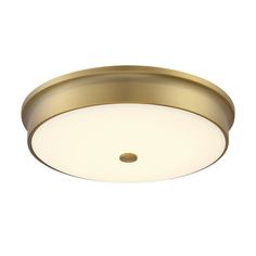 a ceiling light that is on top of a white wall and has a round light fixture in the middle