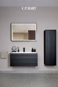 a bathroom with a sink, mirror and cabinet in the wall next to each other