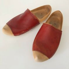 "This is a great pair of Dutch clogs. They are about a size 8 US. They are a beautiful rusty orange red leather, some cracks on the trim from age. Wooden clog very nice condition. Unsigned, we'll made.  See photos some scuff on the leather, a little leather conditioner will make it look nice as its just a surface blemish.  Measurements: Inside heel-toe 8.5\" Inside wides point near toes 3.5\" Inside width near heel 2.5\" Outside heel to toe 11\"" Orange Round Toe Clogs With Rubber Sole, Retro Mules With Wooden Heel And Round Toe, Vintage Closed Toe Mules With Wooden Heel, Retro Brown Closed Toe Clogs, Orange Closed Toe Clogs With Rubber Sole, Retro Closed Toe Mules With Wooden Heel, Vintage Brown Clogs With Round Toe, Vintage Brown Closed Toe Clogs, Vintage Brown Mules With Leather Sole