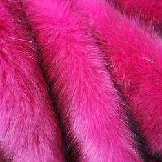 pink and black fur is laying on top of each other