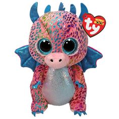 a pink and blue dragon stuffed animal with big eyes on it's head, sitting in front of a white background