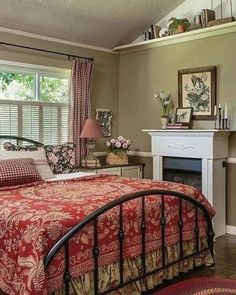 a bed sitting in a bedroom next to a fireplace