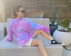 "Our long sleeve tie-dye top comes in two colors. The shirt comes in one size and is modeled on both a petite (5'2\"} woman and tall (6'1\") man. It's the perfect oversized fit on a smaller person that can be worn with biker shorts or belted as a dress. The Sunset colorway was designed with our hometown of Los Angeles in mind. Sizing: One Size (Men's large) Care: Machine wash with like colors; tumble dry low" Tie Dye Long Sleeve Sweatshirt For Spring, Tie Dye Sweatshirt For Spring, Tie-dye Long Sleeve Sweatshirt For Spring, Spring Tie Dye Relaxed Fit Sweatshirt, Long Sleeve Tie Dye Sweatshirt For Spring, Trendy Tie Dye Sweatshirt For Loungewear, Trendy Tie-dye Sweatshirt For Loungewear, Oversized Tie Dye Long Sleeve Sweatshirt, Hand Dyed Long Sleeve Sweatshirt For Loungewear