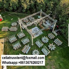 an aerial view of a wedding venue in the middle of a field with lots of tables and chairs