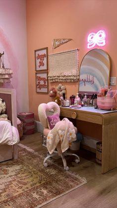 a bedroom with pink walls and furniture in it