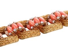 Exquisite 18k gold vintage 1960s bracelet, set with coral and approx. 3.00ctw VS-SI1/H diamonds. DESIGNER: Not Signed MATERIAL: 18k Gold GEMSTONES: Diamond, Coral DIMENSIONS: Bracelet is 6.75" long and 22mm wide. MARKED/TESTED: 18k, E65. WEIGHT: 86.2 grams CONDITION: Previously Owned/Excellent Condition Luxury Coral Jewelry For Formal Occasions, 1960s Bracelet, Sign Materials, Coral And Gold, Georg Jensen, Selling Jewelry, Vintage 1960s, Ring Bracelet, Estate Jewelry