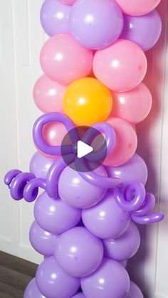 a bunch of balloons that are in the shape of a bear on top of each other