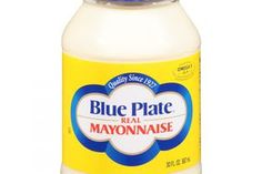 a bottle of mayonnaise on a white background