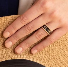 A truly unique statement ring. Beautifully crafted in solid 18k yellow gold and black enamel with hand cut coin edges. An eternity design featuring the Latin word for horse, EQUUS, snaffle bits and star motifs. 9mm wide. Hand made in the US. Wear either side facing up! Bold on its on, or pair with our gold stack ring. A Stunning combination! Available in sizes 6, 6.5, 7, 7.5, 8 (Contact us for other size options) Made to Order. Please allow 4-6 weeks for delivery. Snaffle Bit, Latin Word, Stack Ring, 18k Gold Ring, Enamel Ring, Midnight Black, Black Enamel, Stacking Rings, Statement Ring