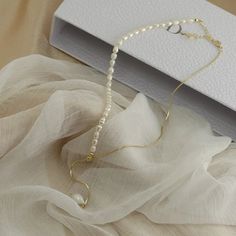 ✦ Enhance her elegance with our Elegant Freshwater Pearl Adjustable Necklace. This exquisite necklace features lustrous freshwater pearls delicately strung on a dainty chain with an adjustable length, allowing her to customize the fit and style. The timeless beauty of the pearls adds a touch of sophistication to any outfit. Gift her this elegant pearl necklace, a symbol of grace and refinement. ----------- DETAILS ------------ SKU: A8432- Materials: Alloy, Brass, Freshwater Pearl- Necklace Lengt Minimalist Pearl Chain Lariat Necklace For Formal Occasions, Minimalist Pearl Chain Lariat Necklace For Formal Events, Minimalist Pearl Charm Lariat Necklace Gift, Minimalist Long Pearl Necklace, Minimalist Pearl Lariat Necklace As Gift, Pearl Lariat Necklace With Adjustable Chain For Gifts, Elegant Lariat Chain Necklace With Pearl Drop, Elegant Adjustable Pearl Chain Necklace, Elegant Adjustable Pearl Necklace With Pendant