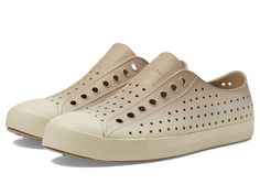 Native Shoes Jefferson Sugarlite Ombre - Shoes : Flax Tan/Bone White/Flax Bone Ombre : Featuring a perforated detailing and a round-toe design for comfort, the Native Shoes Jefferson Sugarlite Ombre are the perfect pair to style your everyday wear look. These shoes have a slip-on closure and can be adjusted accordingly. Style them along with your accessories and add them to your stylish footwear collection. Synthetic upper. Synthetic lining and insole. Synthetic outsole. Imported. Measurements: Weight: 7 oz Product measurements were taken using size Men's 9, Women's 11, width Medium. Please note that measurements may vary by size. Beige Closed Toe Outdoor Sneakers, Beige Flat Sneakers With Perforated Toe Box, Beige Closed Toe Sneakers With Rubber Sole, Casual Beige Sneakers With Vented Sides, Beige Slip-on Walking Sneakers, Beige Slip-on Sneakers For Walking, Casual Cream Sneakers With Vented Sides, Beige Slip-on Outdoor Sneakers, Beige Slip-on Sneakers For Outdoor Activities