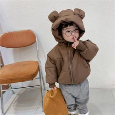 Introducing our Hooded Puffer Bear Jacket, the perfect blend of warmth, style, and cuteness for your little ones. This jacket is not just a winter essential; it's a delightful fashion statement that will make your child the star of any outing. The standout feature is the lovable bear design on the hood, complete with fuzzy bear ears, adding an element of charm that kids adore. Cartoon Jacket, Bear Jacket, Cotton Clothes, Korean Boys, Bear Ears, Kids Coats, Boys Coat, Winter Clothing, Warm Coat