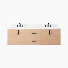 the double sink vanity has two black faucets on it's sides and is made from wood