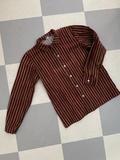 This is a preppy vintage shirt from Finnish company Marimekko. Classic style Jokapoika shirt, child approx 150-160cl. (size label is missing). Bordeaux and Green stripes. Very nice design, pocket and classic metal buttons in the front.  Nice crispy cotton cloth. very Good condition.  Don't hesitate to ask for Measurements in CM or inches.  Chest is 100cm. Made in Suomi Finland. ♪♫♬ Cotton Long Sleeve School Shirt, Preppy Collared Cotton Shirt, Classic Cotton School Blouse, Retro Long Sleeve Cotton Shirt, Retro Long Sleeve Top With Striped Collar, Retro Long Sleeve Relaxed Fit Blouse, Retro Blouse With Relaxed Fit And Long Sleeves, Multicolor Long Sleeve Shirt For School, Green Long Sleeve Shirt With Striped Collar