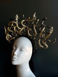 Medusa headpiece embellished with gold and black shade painted snakes!  C U S T O M I Z A T I O N Can be customized further, get in touch for custom orders! S I Z E  Adult size. S H I P P I N G -  Processed same day or within 24 hours.  1-2 day guaranteed delivery, add item to cart, click shipping tab for rates.  Pls leave a check out note with your need date & contact number  Msg for delivery time frames (Include your state/country) C O N T A C T  Please contact us via ETSY messages. P H O T O  Images displayed on this listing are property of www.higginscreek.com A B O U T HigginsCreek makes elegant and fun photography props for adults and children for all special occasions.   Thank you & wish you a fabulous Etsy experience! Ceremonial Black Adjustable Headpieces, Adjustable Black Ceremonial Headpiece, Gold Headpiece For Halloween Party, Gold Headpieces For Halloween Party, Adjustable Gold Headpiece For Costume, Gold Halloween Party Headpiece, Gold Fitted Festival Headpiece, Adjustable Gold Costume Headpieces, Gold Adjustable Costume Hats And Headpieces