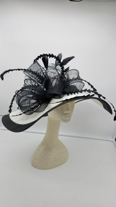 Beautiful Large Black and White Hat. Large brim. Black Wedding Hat, Fascinator Bridesmaids Hat Kentucky Derby, Cocktail Party, Tea Party, funeral - 23 inches head and 60 inches brim - Rare find - Ready to ship - Fast Shipping - Free Shipping - Group discount available - Customize by adding different color flowers and or feathers Check my store for for styles and colors. Hatsandpearls.etsy.com Find more at my website for more styles: www.hatsandpearls.com Reach out to me if you can't find what yo Luxury Black Costume Hats And Headpieces For Party, Affordable Black Themed Hat, Luxury Custom Black Hat, Luxury Black Hat Bands For Kentucky Derby, Luxury Black Top Hat For Kentucky Derby, Black High Crown Hat For Races, White Fedora Costume Hat For Party, Black Flat Brim Top Hat For Party, Black Party Costume Hat With Flat Brim