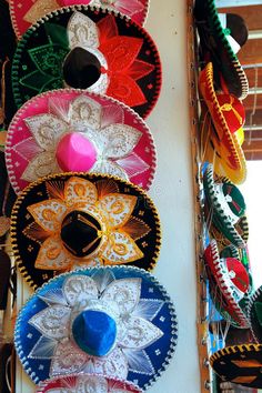 souvenirs and hats are hanging on the wall